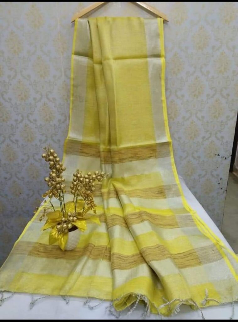 Linen sarees neatly folded for proper storage