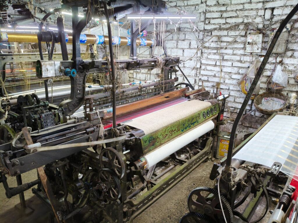 Indian handloom weaver crafting saree on loom