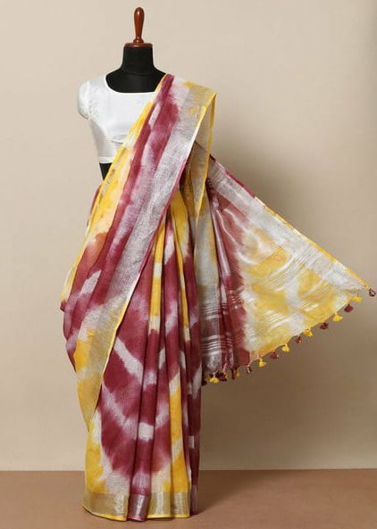 Woman draped in pure linen saree