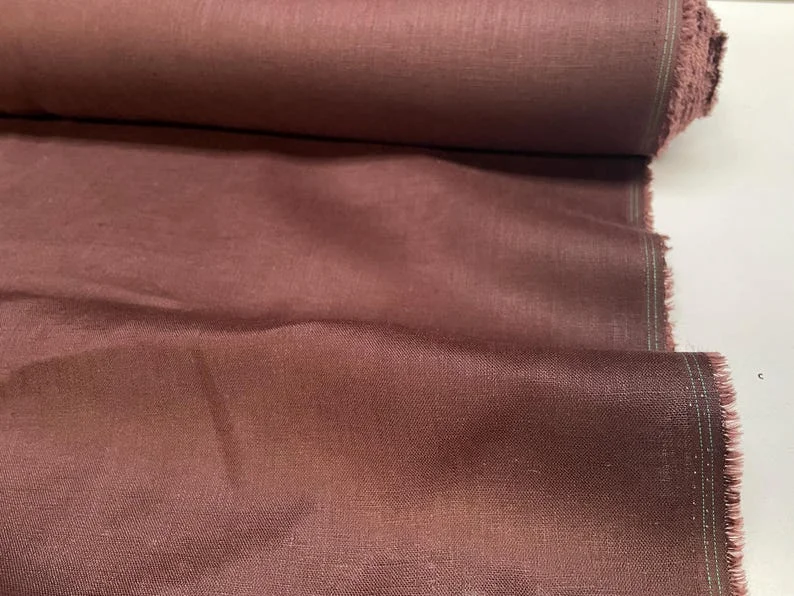 Handwoven Bhagalpur silk showcasing natural texture and golden sheen for luxury European apparel brands.