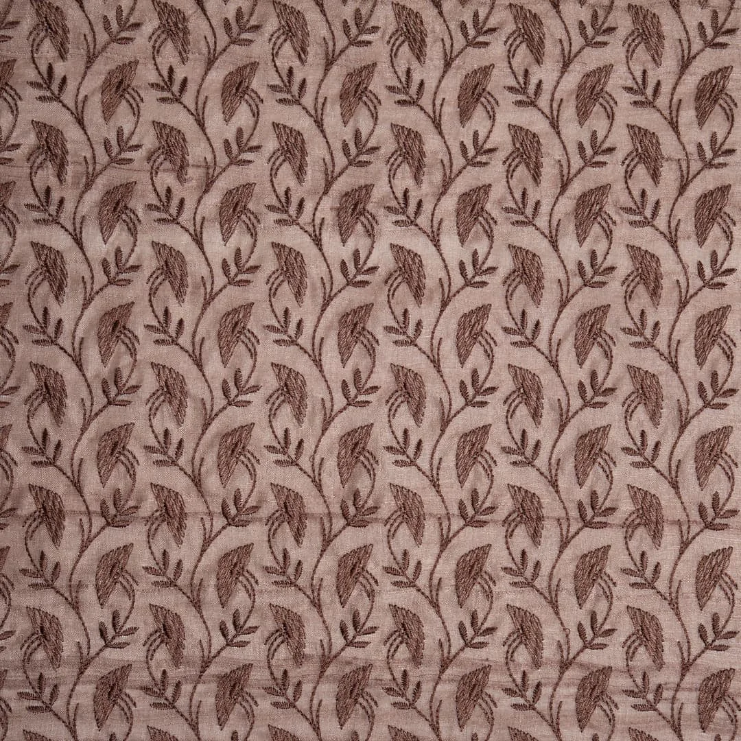 embroidered fabric design with thread and decorative patterns