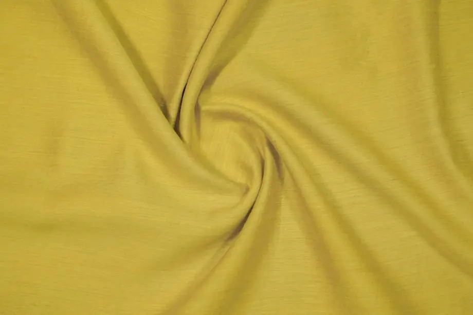 muga silk fabric texture showing natural golden color